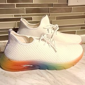 White Meshed Tennis Shoe. Colorful Bottoms. Size 9